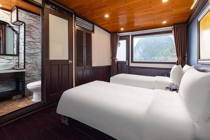 2-Day Boutique Cruise Discover Hidden Gems of Bai Tu Long Bay - Day 2: Tai Chi breakfast, Vung Vieng rowing, and the return cruise
