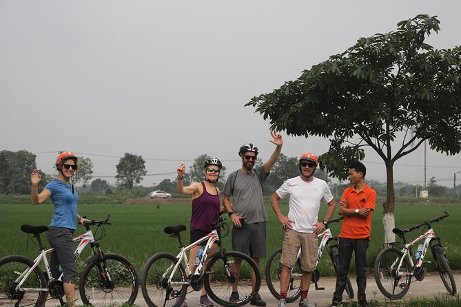 Bicycle Tour Full Day Explore Red River Delta & Rural Villages - Visiting a local family: fruit from a farm and everyday life lessons