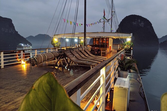 BOUTIQUE CRUISES Halong Bay 2 Days,1 Night Tour: Swimming,Caving, and Kayaking - Sunset Welcome Drink, Deck Party Energy, and Optional Squid Fishing