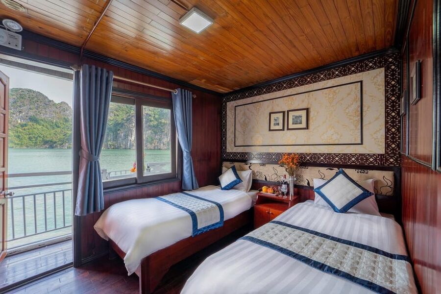 From Hanoi: 2-Day Ha Long Bay Boat Tour - Ship life on Ha Long Bay: cabins, food, and that AC window