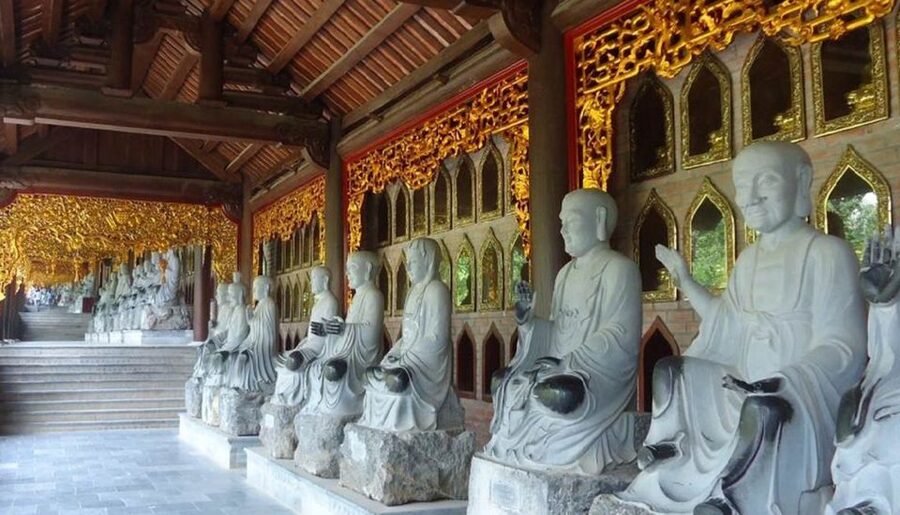 From Hanoi: Bai Dinh, Trang An, and Mua Cave Full-Day Tour - Trang An Wharf Boat Trip Through the Cave Complex