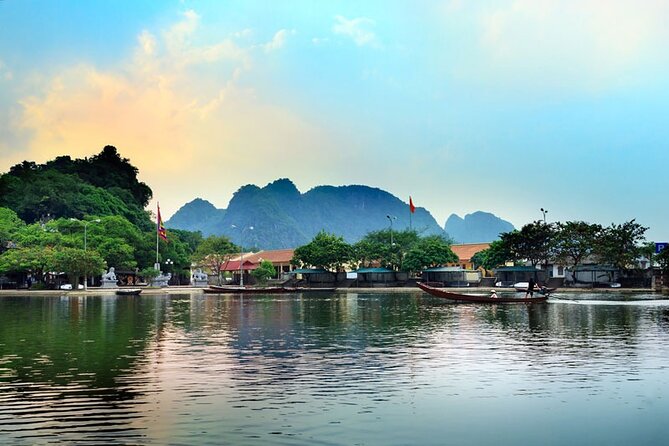 Full Day Tour to Perfume Pagoda with Traditional Boat Ride - The sampan ride to the temple area: calm water, short steps later