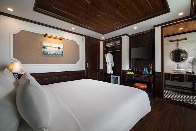 Halong Bay 2 Day Cruise Including Transfer from Hanoi - Day 1 on Halong Bay: caves, kayaking, and an onboard evening