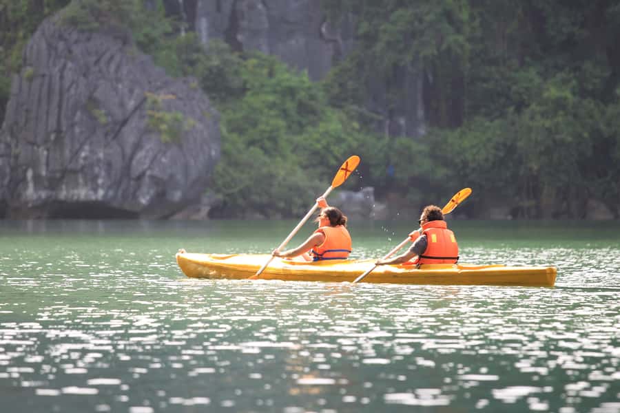 Halong Bay: Day Cruise with Caves, Kayaking & Sunset Party - Titop Island: swim, photos, coffee, or hike for the panorama