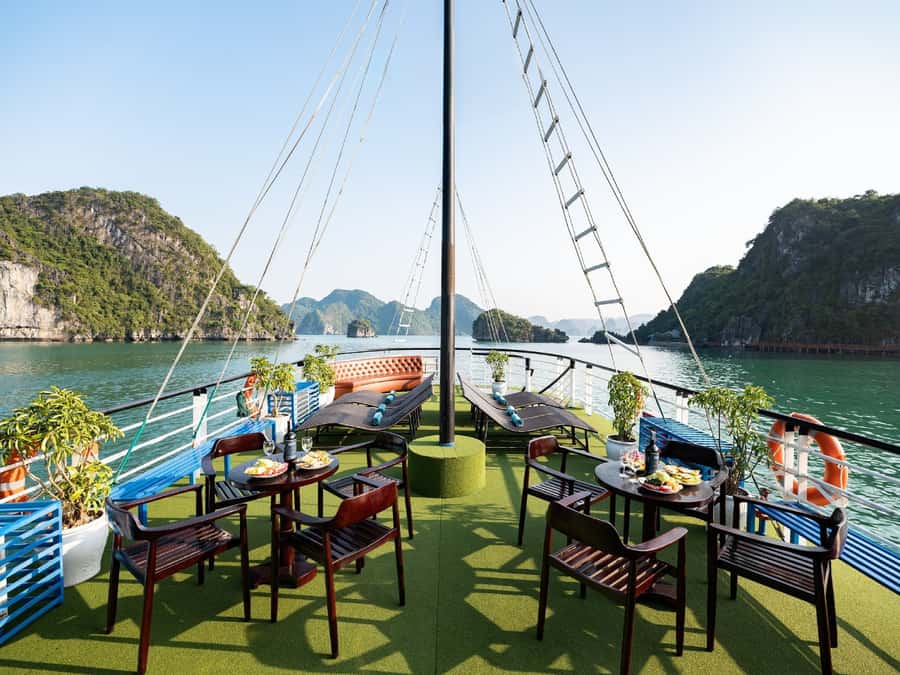Halong Bay: Day Cruise with Caves, Kayaking & Sunset Party - Sunset party on board: wine, fruit, and a calmer bay mood