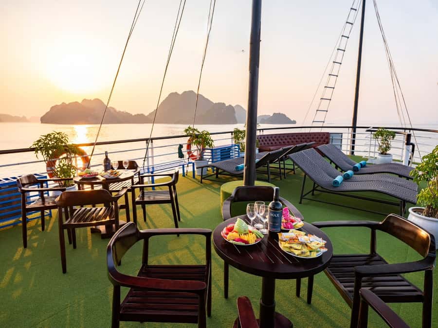 Halong Bay: Day Cruise with Caves, Kayaking & Sunset Party - Cruising past Dog Rock, Incense Burner, and the Fighting Cock Islet