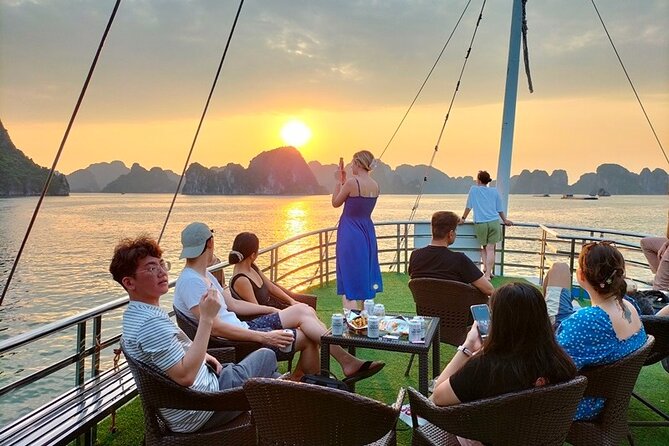 Halong Bay Day Tour 6Hour Deluxe Cruise Limousine Bus Small Group - Hang Luon Cave: kayaking or bamboo boat on the water