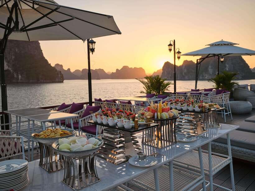 Halong bay day tour: Best seller IRIS CRUISE with live band - On board the floating theater: sundeck setup, live music, and the “day at sea” feel
