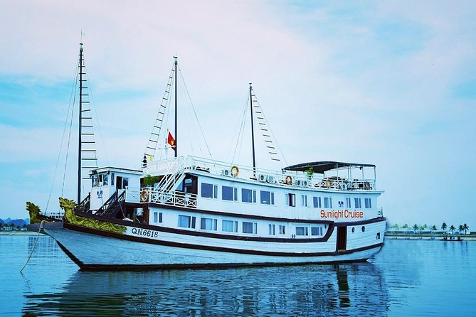 Halong deluxe cruise 2D/1N: Surprise cave, Titop island, Full Meals, best prices - Day 2 dawn and Titop Island: views, beach breaks, and a short window to breathe