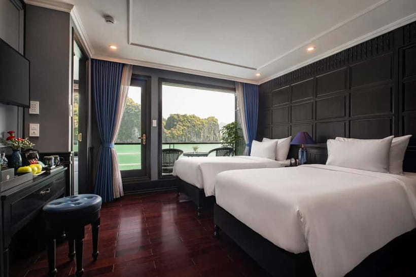 Hanoi: 2-Day Halong-Lan Ha Bay BEST SELLER 5<em> cruise balcony – The Best Parts to Know Before You Go’ /></p>
<ul>
<li><strong>Private balcony cabin comfort:</strong> You get a real place to cool down, shower, and watch the bay as the light changes.</li>
<li><strong>Kayak + swimming stops:</strong> You’re not stuck on a big viewing-only boat; you’ll paddle through limestone scenery and have swim time.</li>
<li><strong>Cave exploration by kayak/bamboo boat:</strong> The cruise plans cave routes based on tide, so timing can shift.</li>
<li><strong>Sunset tea and spring roll cooking:</strong> The evening has a calm rhythm, then you switch gears to make traditional Vietnamese spring rolls.</li>
<li><strong>Tai chi at sunrise:</strong> Early movement on the water is a great reset, especially when the sky is still doing its thing.</li>
<li><strong>Night squid fishing:</strong> Even if you’re not a fisherman, it’s a fun night activity—more social than serious.</li>
</ul>
<h2 id="from-hanoi-pickup-to-tuan-chau-how-the-day-flows">From Hanoi Pickup to Tuan Chau: How the Day Flows</h2>
<p><img width="820" height="461" decoding="async" src=