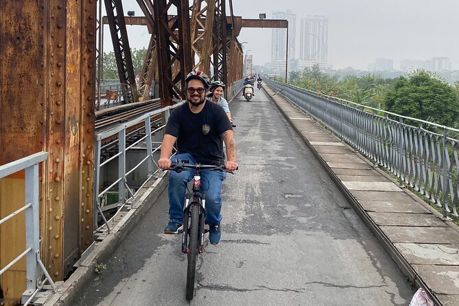 Hanoi City Bike Tour through Banana Island & Food Tasting - Railway tracks and Duờng Tau: coffee, cafes, and a street with a pulse