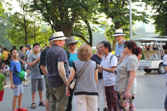 Hanoi City Street Food Night Tour by Motorscooter - Dong Xuan Market and landmark strolls that help you orient