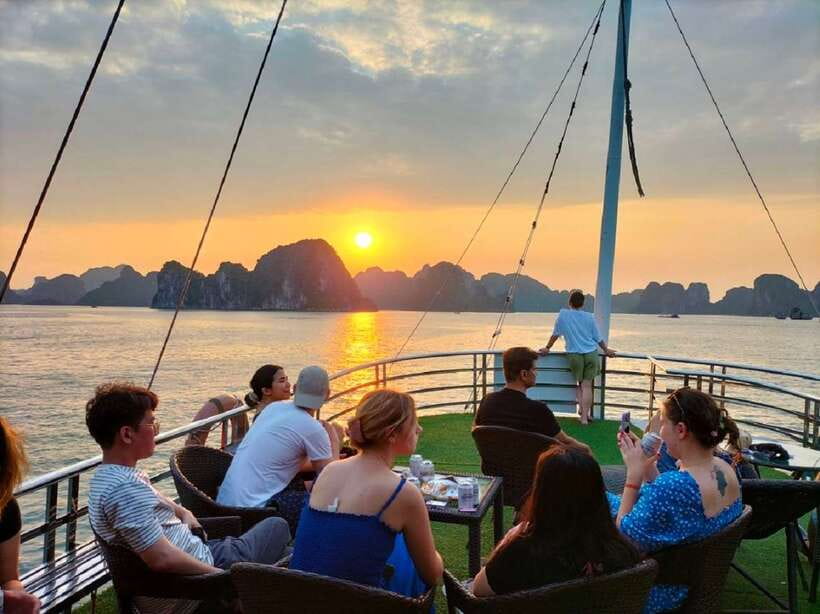Hanoi: Ha Long Bay Day Cruise - Swimming, Meal, Kayaking - Sunset party on the bay: red wine, fruit, and a calmer finish