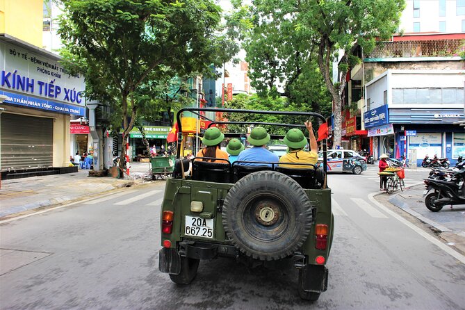 Hanoi Jeep Tours Led By Women: Hanoi City Jeep Tours - A vintage Vietnamese Army jeep in Hanoi, led by women