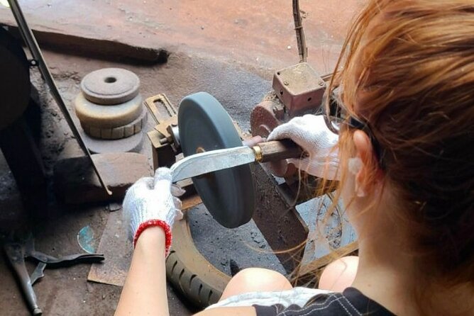 Hanoi Knife Making Traditional Workshop - Grinding and sharpening: the tar-based wash step that makes it work