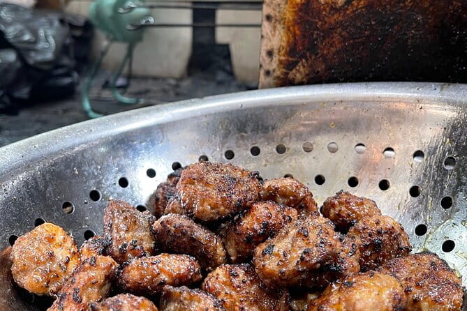 Hanoi Michelin Star Food Tour Via Jeep, Vespa or Motorbike - Stop 3: Bún Chả Dac Kim—grilled pork, noodles, herbs, and a very famous fan