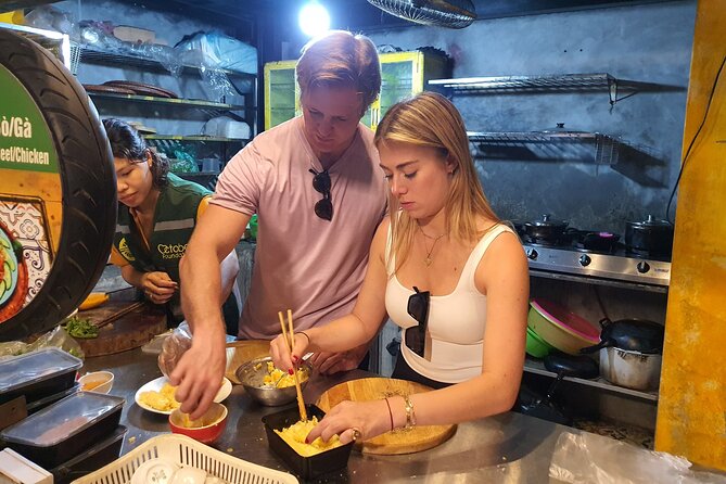 Hanoi Michelin Star Walking Food Tour & Train Street - Stop 1: Bach Mã Temple gives you a quick cultural reset