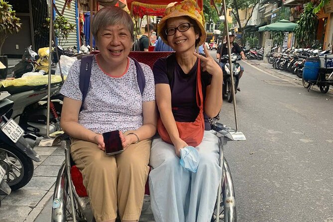 Hanoi Street Food Tour by Motorbike or Walking with Local Guide - Phùng Hưng Mural Street: art under the old railway bridge