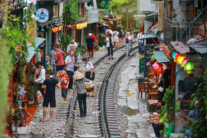 Hanoi Vespa After Dark Street food + Train Street+ Live Music - Opera House and the French Quarter photo window