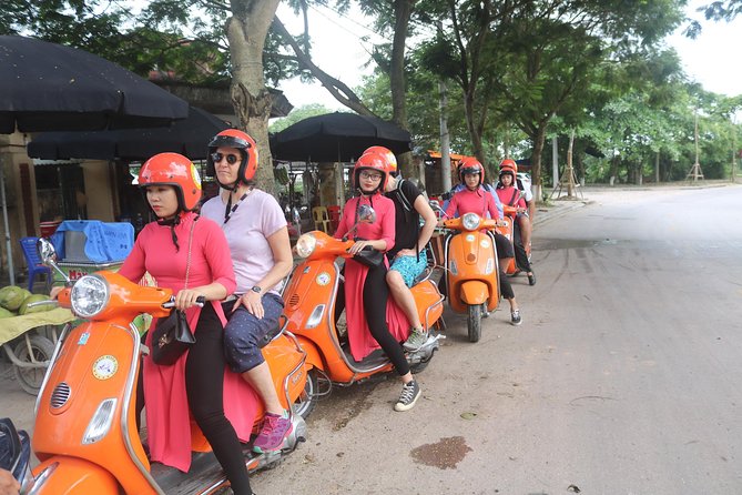 Hanoi Vespa Full Day City & Countryside with Female Ao Dai Riders - Long Bien Bridge and the Red River: the photo stop that feels cinematic
