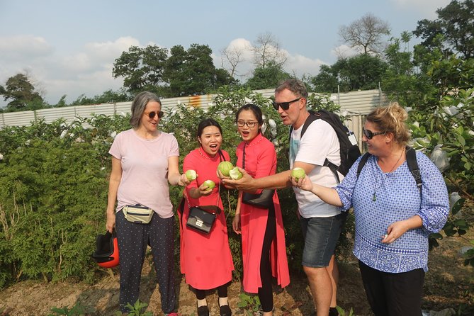 Hanoi Vespa Full Day City & Countryside with Female Ao Dai Riders - Co Loa Citadel roads and a local market you’ll actually remember