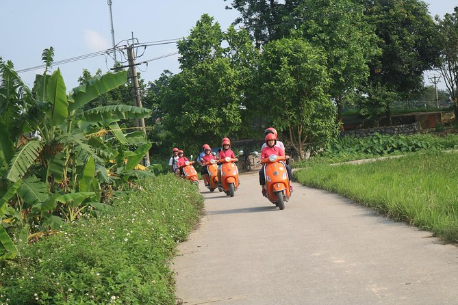 Hanoi Vespa Full Day City & Countryside with Female Ao Dai Riders - West Lake, botanical garden vibes, and the B-52 crash site at Hữu Hiệp Lake