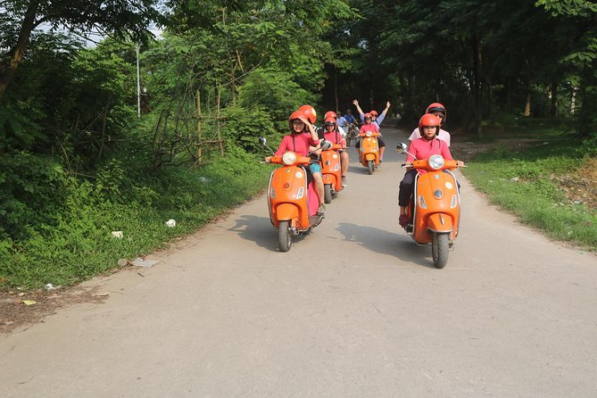 Hanoi Vespa Full Day City & Countryside with Female Ao Dai Riders - Dường Tau rail tracks: close enough to feel the daily routine