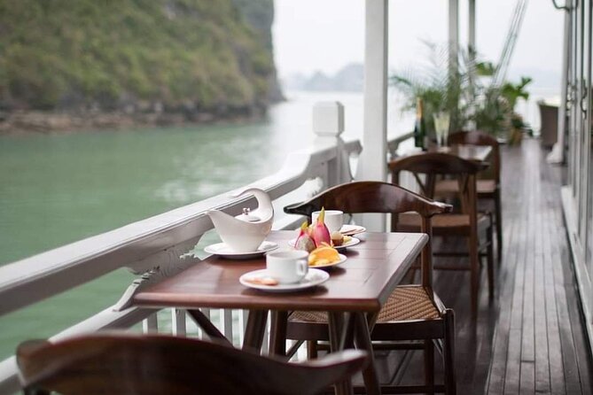 Hera Classic Cruise 2 Days 1 Night Halong Bay With BALCONY CABINS - Day 2 at 06:15: Tai Chi, coffee/tea breakfast, and then off to the caves