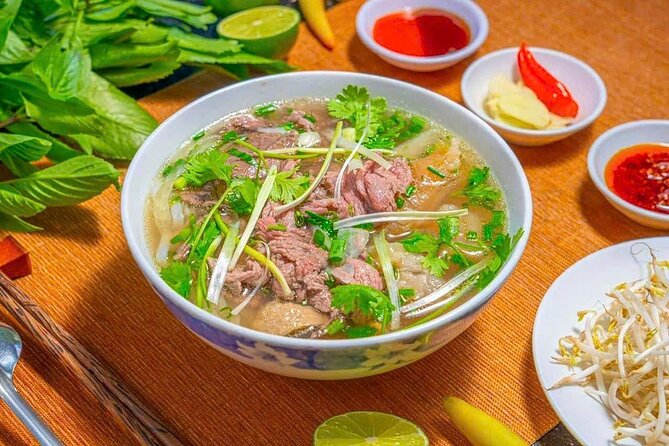(HOT) Hanoi Guided Street Food and Train Street Tour with Local - Start at Thang Long Water Puppet Theatre and get oriented fast