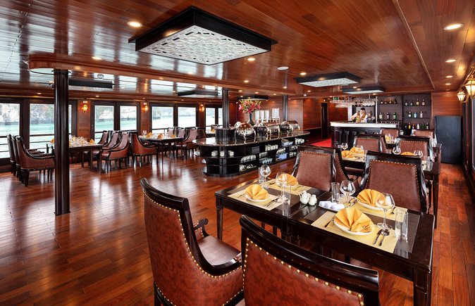 Luxury 4<em> Cruise 2Days 1night Ha Long Bay – V'spirit Premier Cruise – Key highlights at a glance’ /></p>
<ul>
<li><strong>A 3-deck luxury ship with Vietnamese-style design touches</strong> that keeps the ride feeling special, not just practical</li>
<li><strong>Private balcony cabins</strong> so you can watch Lan Ha Bay without waiting for a deck crowd</li>
<li><strong>Lan Ha Bay, the less-famous neighbor</strong> with a route often described as calmer and less rigid than the main Halong track</li>
<li><strong>Dark & Bright caves plus swimming option</strong> for a change of pace from deck time</li>
<li><strong>Tra Bau kayaking and a fishing farm visit</strong> that adds local context, not just photos</li>
<li><strong>Onboard cooking demonstration and Tai Chi</strong> to round out the trip beyond boats and caves</li>
</ul>
<h2 id="getting-to-the-bay-hanoi-to-haiphong-by-luxury-limousine">Getting to the bay: Hanoi to Haiphong by luxury limousine</h2>
<p><img width="669" height="446" decoding="async" src=