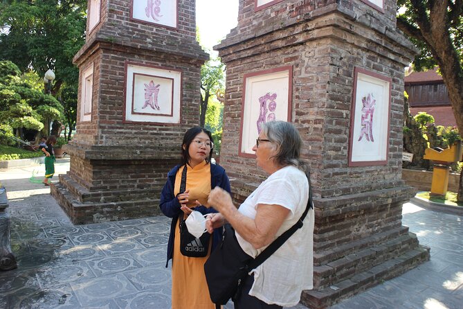 Motorbike Tours Hanoi Led By Women: City & Countryside Half Day - Duờng Tàu Reunification train track: homes next to an active line