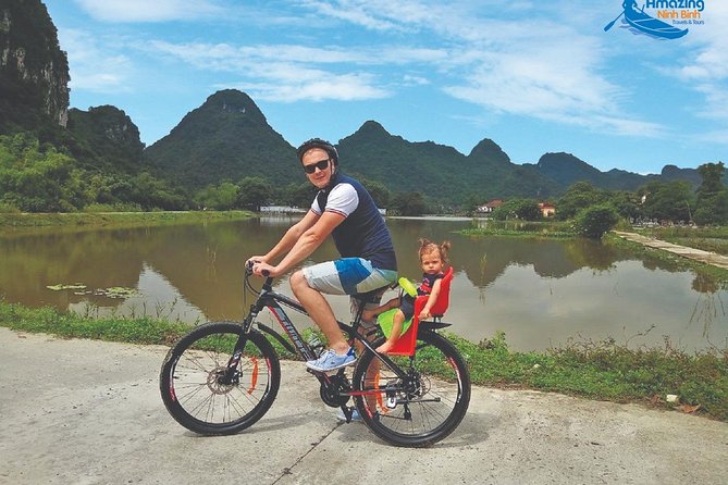 Mua Cave - Tam Coc - Bich Dong Day tour with transfer, local family & bike - Tam Coc on the Ngo Dong River: the classic boat calm