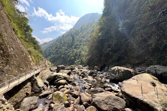Sapa Motorbike Tour to Dragon Waterfall and Hidden Village - Muong Hum market: the valley stop you’ll remember for the setting
