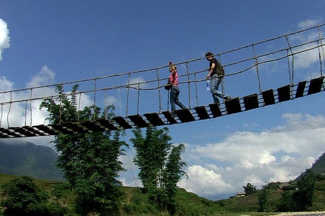 Sapa Trek Tours -2D1N Stay At 3</em></strong> -TRANSFER BY SLEEPING BUS – The 3*** Overnight in Sapa: What You Gain by Staying the Night’ /><br />
This is a true 2D1N format, and that overnight in Sa Pa is more important than it sounds. You’re not rushing through a single day trip where you arrive, snap a few photos, and race back down the mountain. Instead, you get time to slow down in town, settle in, and do the next day’s walk with better energy.</p>
<p><p>The tour includes accommodation at a <strong>3</strong>* hotel in Sapa town. Based on the strongest feedback, people really liked having a comfortable place to return to, especially after time outdoors. There’s something simple but valuable about being able to shower, eat well, and regroup in one place rather than stacking more transit onto an already full itinerary.</p>
</p>
<p><p>Even better: the overnight stay gives you a chance to experience local food in town. Several guests highlighted enjoying meals and trying rice wine with the group during the evening. That’s the kind of “bonus culture” you tend to miss when you stay only one night in transit mode.</p>
</p>
<h2 id="day-1-at-cat-cat-village-river-sounds-craft-stops-and-easy-exploration">Day 1 at Cat Cat Village: River Sounds, Craft Stops, and Easy Exploration</h2>
<p><img width="669" height="446" decoding="async" src=
